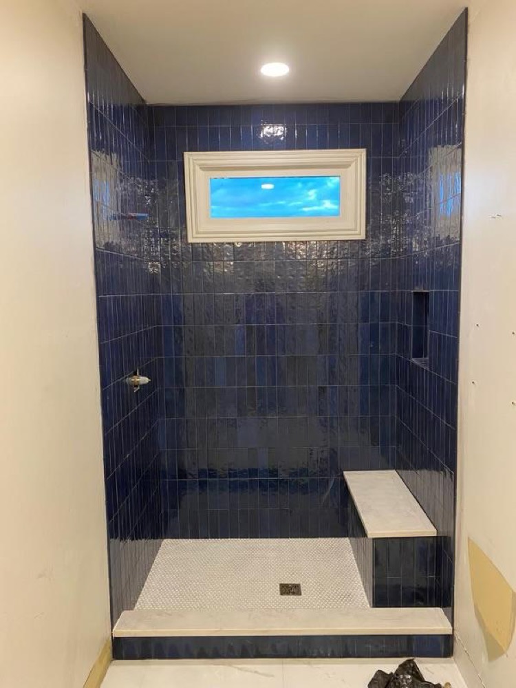 Navy blue tile walk-in shower